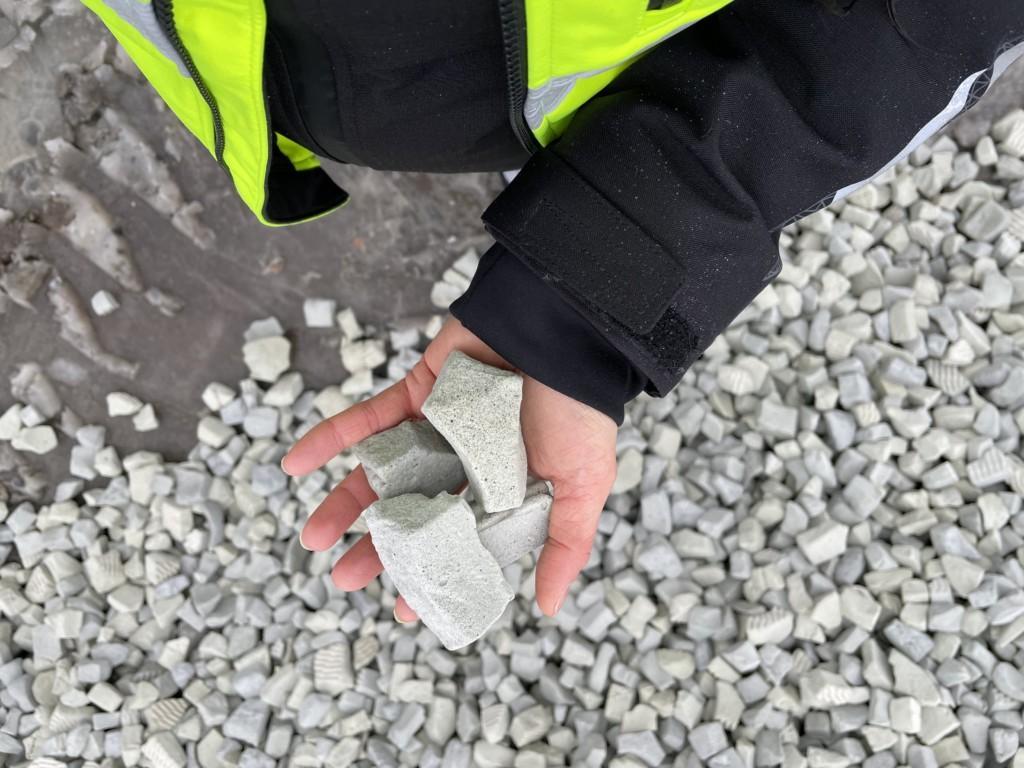 A person holding foam glass aggregate.